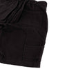 Close-up of black shorts with two front pockets on a white background